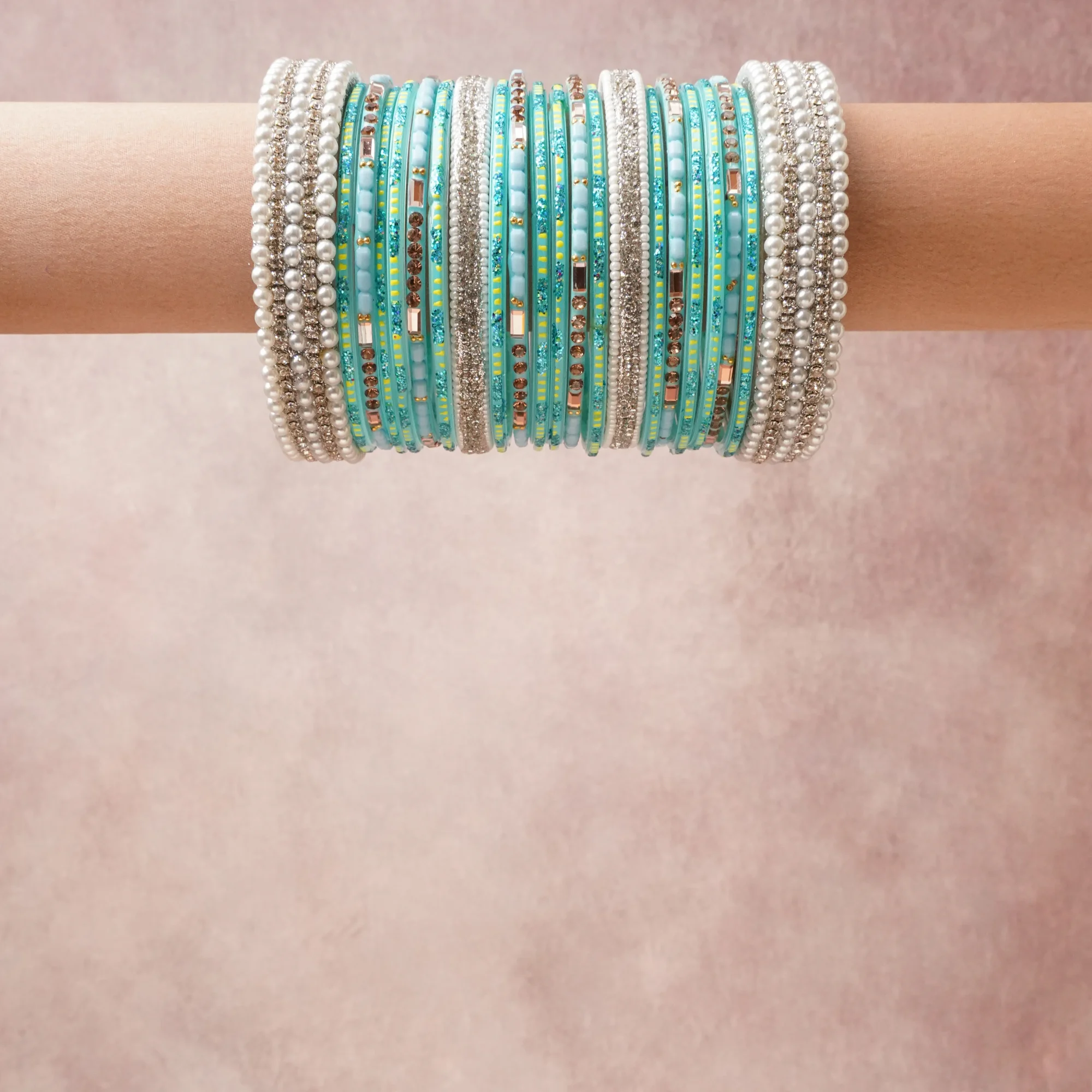 A grounding Aqua Blue forms the heart of the set, while touches of Pearl White, Silver, Chartreuse Yellow, Bronze, Pale Rose, Teal Glitter add charm.

A thoughtful composition of Faux Pearls, Glass, Rhinestones, Glitter, Silver-tone Metal, designed to feel complete without being heavy.
Each element layers seamlessly, creating a look that is refined, wearable and quietly striking.